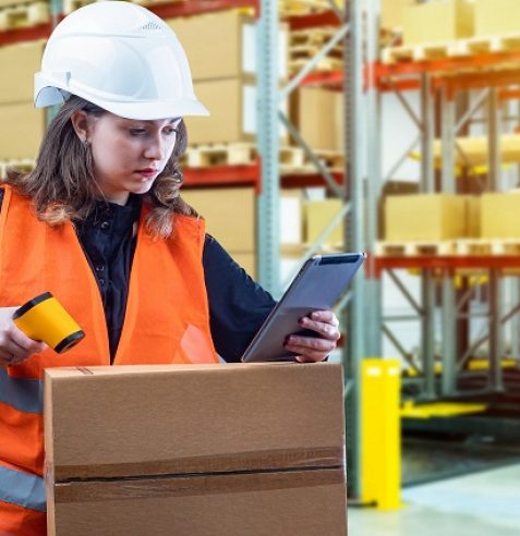 Warehouse,Worker.,Portrait,Of,Woman,With,Barcode,Scanner,At,Warehouse.
